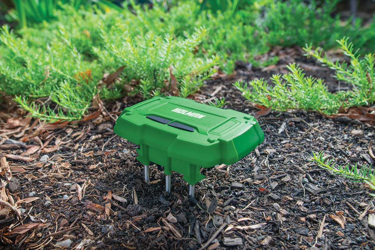 Smart moisture sensor with prongs pushed into soil for accurate readings. These readings are tracked to your smartphone